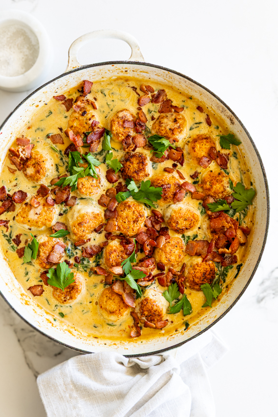 Marry Me Chicken Meatballs in a white casserole dish.