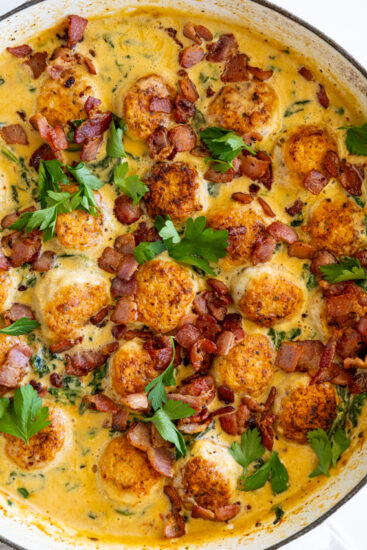 Marry Me Chicken Meatballs in large braised garnished with parsley.