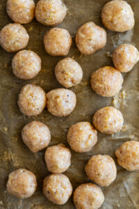Chicken meatballs on a sheet pan.