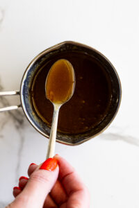 Caramel sauce in a small saucepan.