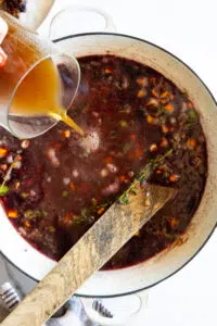 Stock poured into stew.