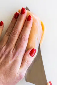 Chicken breasts sliced into cutlets.