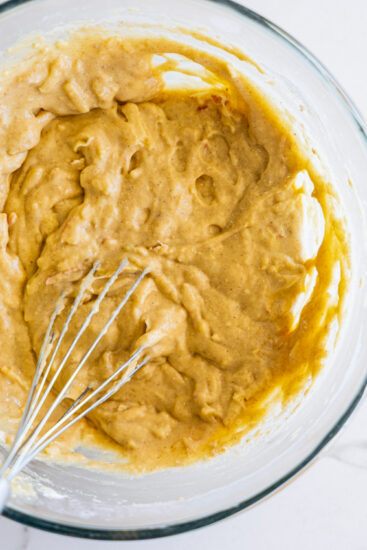 Batter for Applesauce fritters in a glass bowl.
