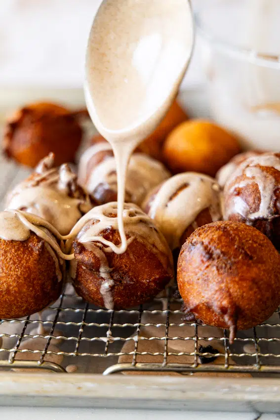 Applesauce Fritters drizzled with cinnamon glaze.