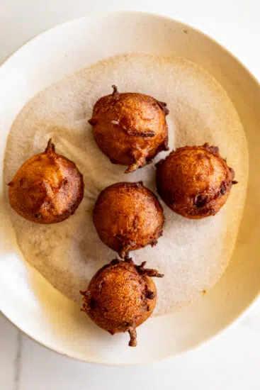 Fried applesauce fritters with cinnamon sugar.