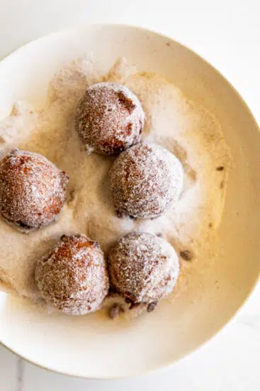 Fried applesauce fritters with cinnamon sugar.