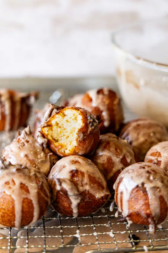 Applesauce fritters with cinnamon glaze.
