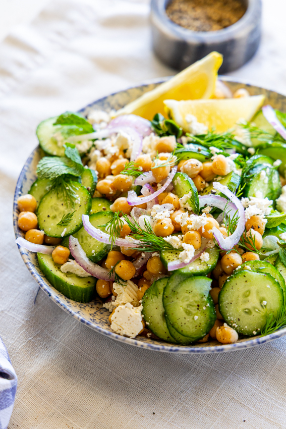 Chickpea and Cucumber Salad in a serving bowl on a table.