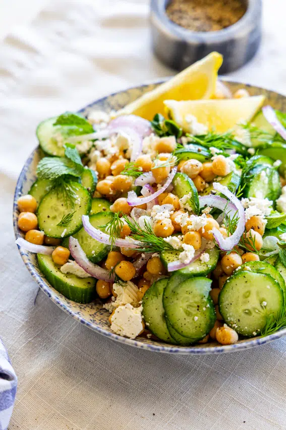 Chickpea and Cucumber Salad in a serving bowl on a table.