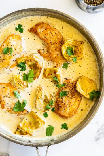 Seared chicken and artichokes in creamy sauce.
