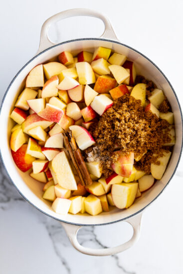 Chopped apples, brown sugar and cinnamon in a saucepan.
