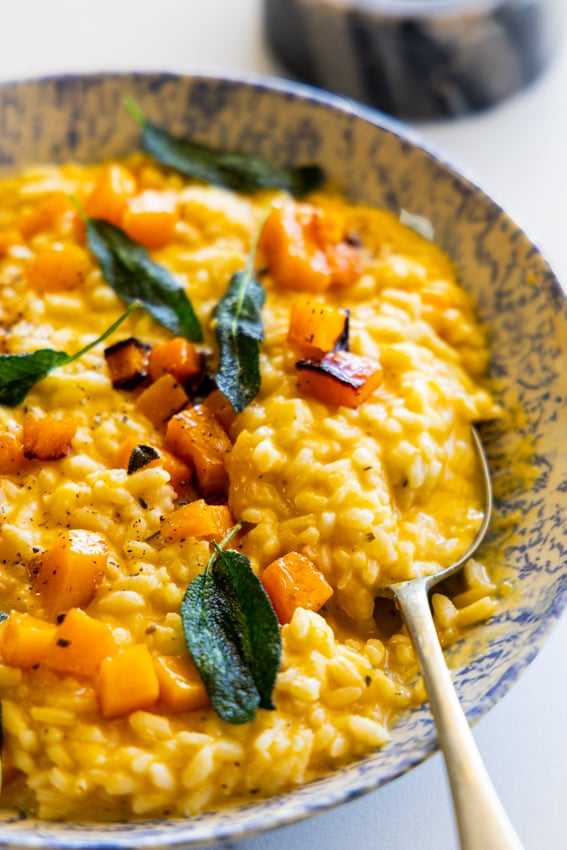 Butternut Squash Risotto in serving bowl with spoon.