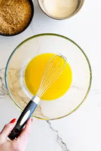 Melted butter in a glass mixing bowl.