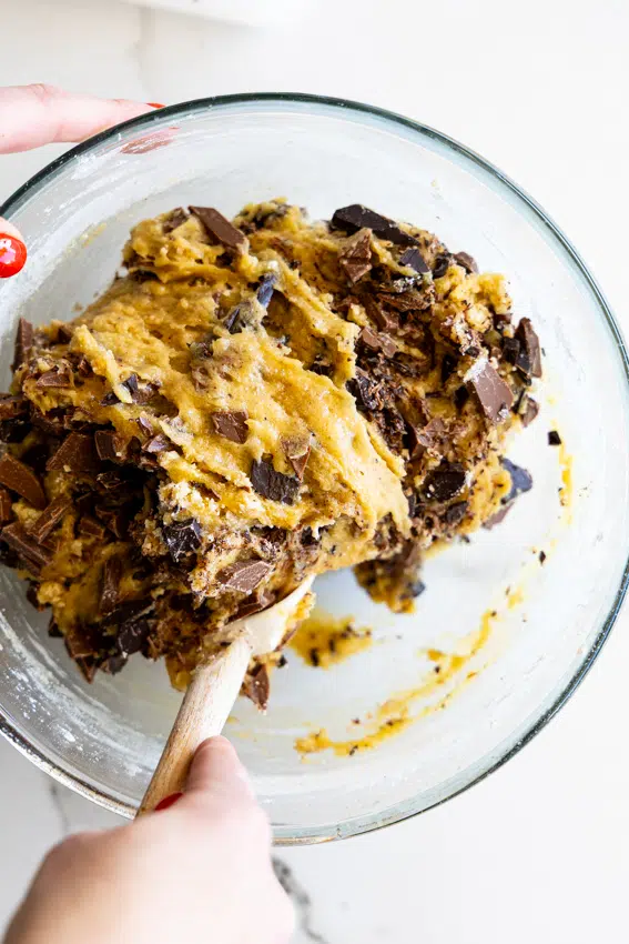 Chocolate chunk cookie dough stirred together.