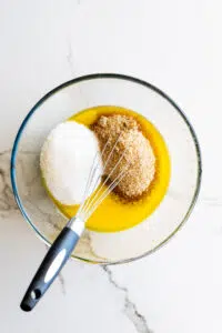 Brown and white sugar added to melted butter.