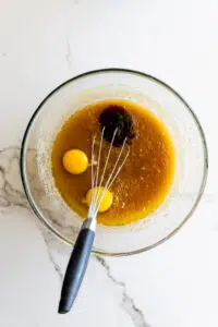 Egg and vanilla with melted butter and sugar.