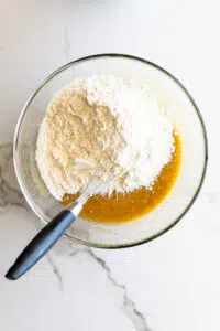 Dry ingredients added to cookie batter.