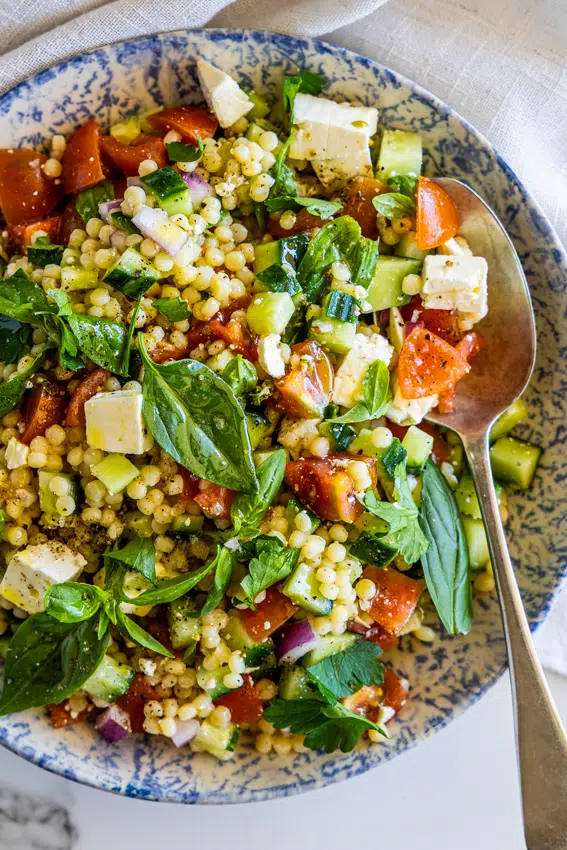 Pearl Couscous Salad with tomatoes, cucumber and feta cheese.