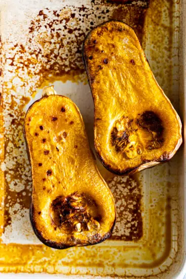 Roasted butternut squash on a baking tray.