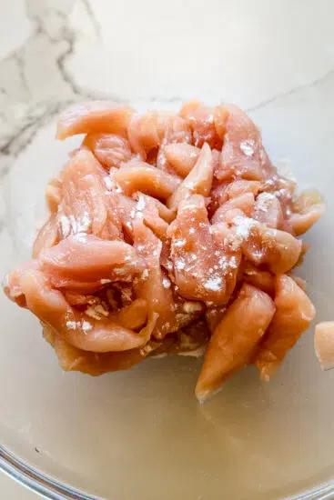 Chicken tenderized with baking soda for stir fry.