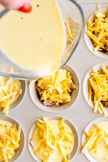 Egg bite mixture poured into muffin pan