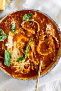 Easy Lasagna Soup with fresh basil and mozzarella cheese.
