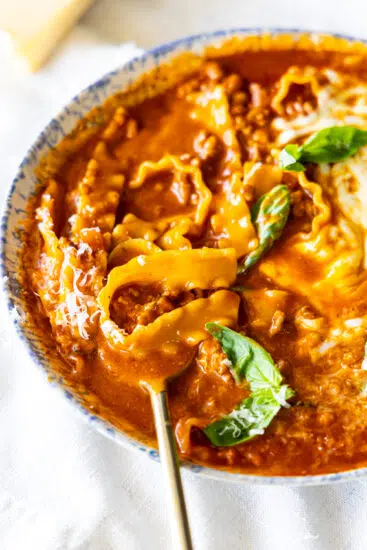 Easy Lasagna Soup in serving bowl with spoon.