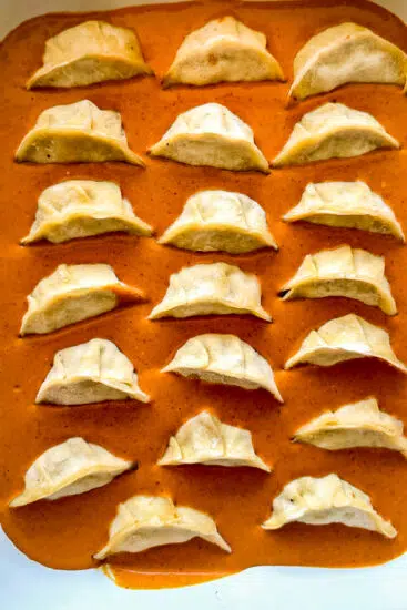 Frozen dumplings in Thai coconut broth.