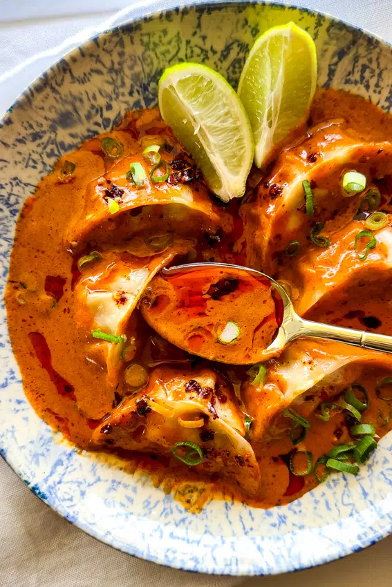 Frozen dumplings baked in fragrant Thai coconut broth served with chilli oil.