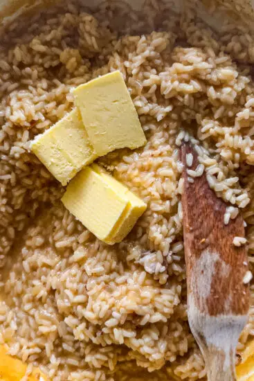 Butter stirred into risotto.