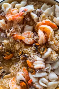 Seafood stirred into risotto.