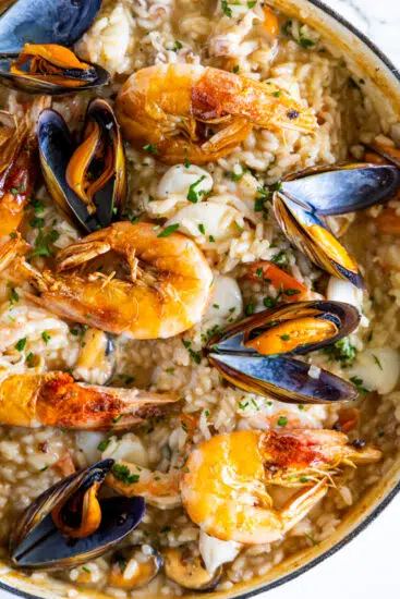Seafood risotto topped with shrimp, mussels and calamari