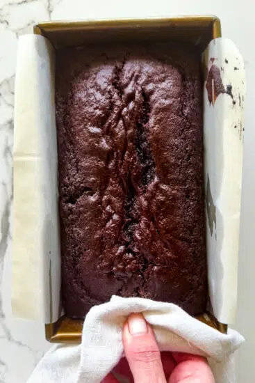 Baked chocolate pound cake in a loaf tin.