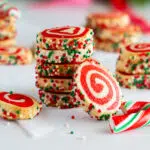 Festive pinwheel cookies stacked.