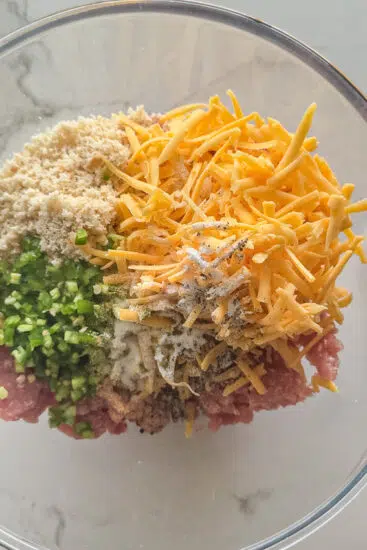 Sausage roll mixture in mixing bowl.