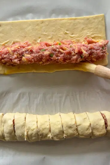 Sausage mixture placed into sheets of puff pastry.