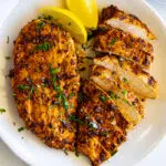Easy air fryer chicken breast on a plate.