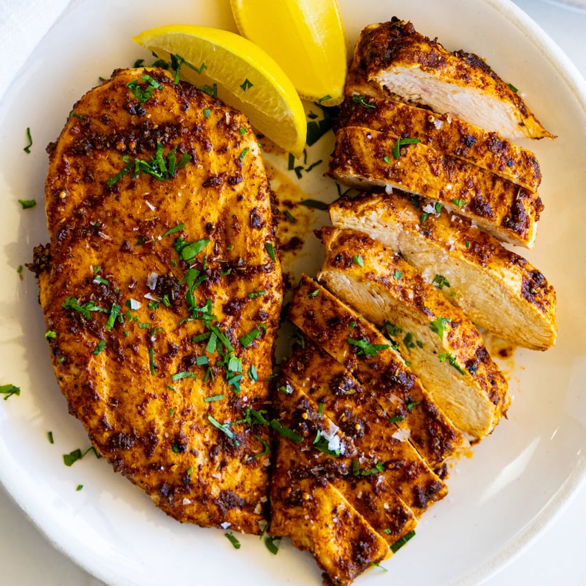 Easy air fryer chicken breast on a plate.