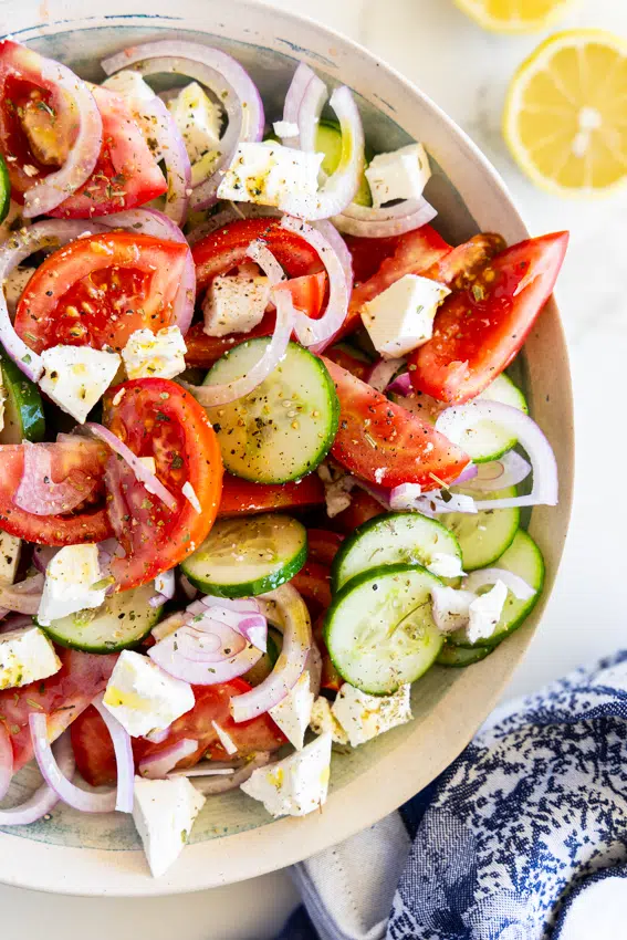 Cucumber tomato and feta Salad in a serving bowl.