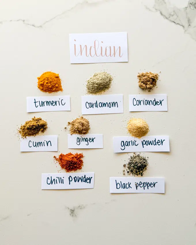 Indian spice blend with turmeric, cardamom, coriander, cumin, ginger, garlic, chilli powder and black pepper.