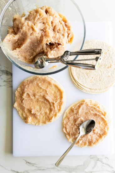 Seasoned ground chicken smashed onto flour tortillas/wraps.