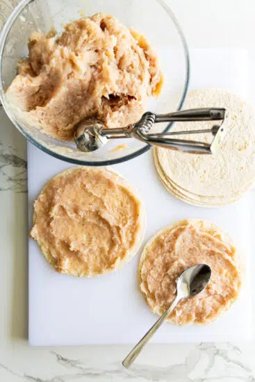 Seasoned ground chicken smashed onto flour tortillas/wraps.