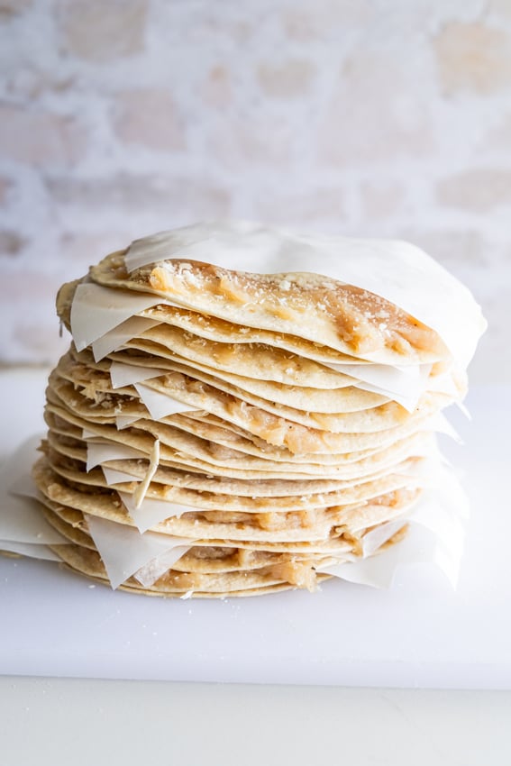 McChicken Smashed Tacos stacked with parchment paper.