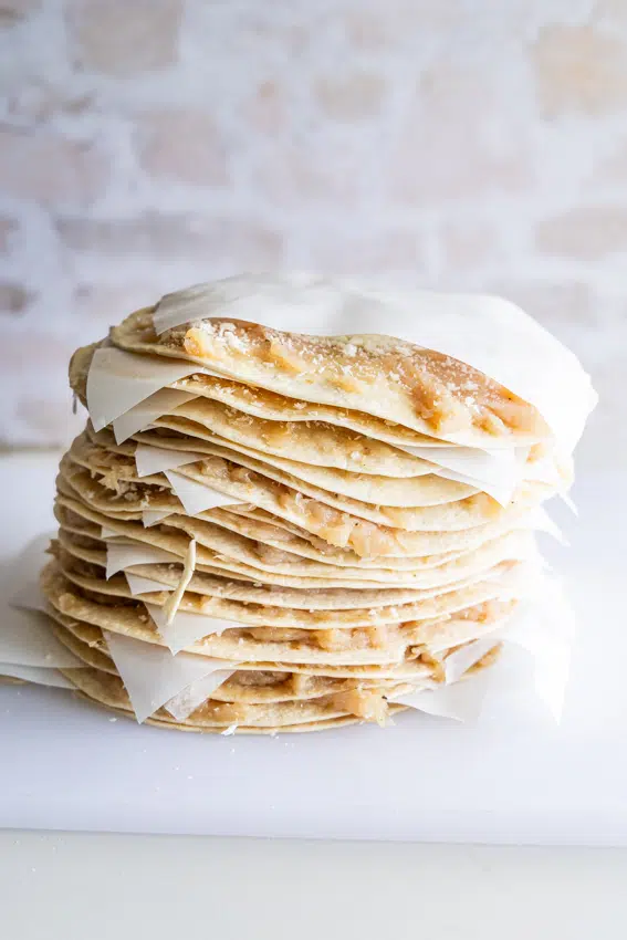 McChicken Smashed Tacos stacked with parchment paper.