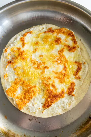 Golden brown McChicken Smashed Tacos in pan.