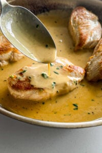 Dijon cream sauce spooned over chicken