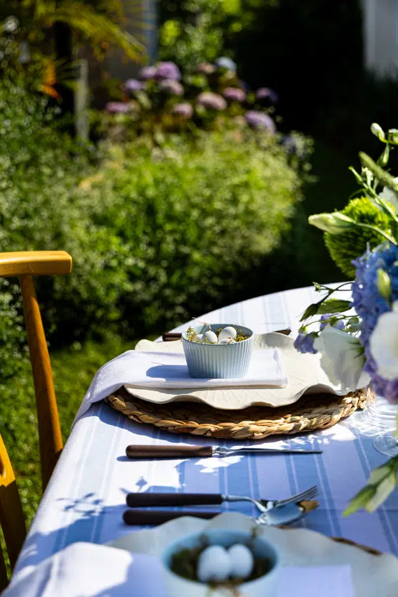 An elegant Easter table set in the garden.