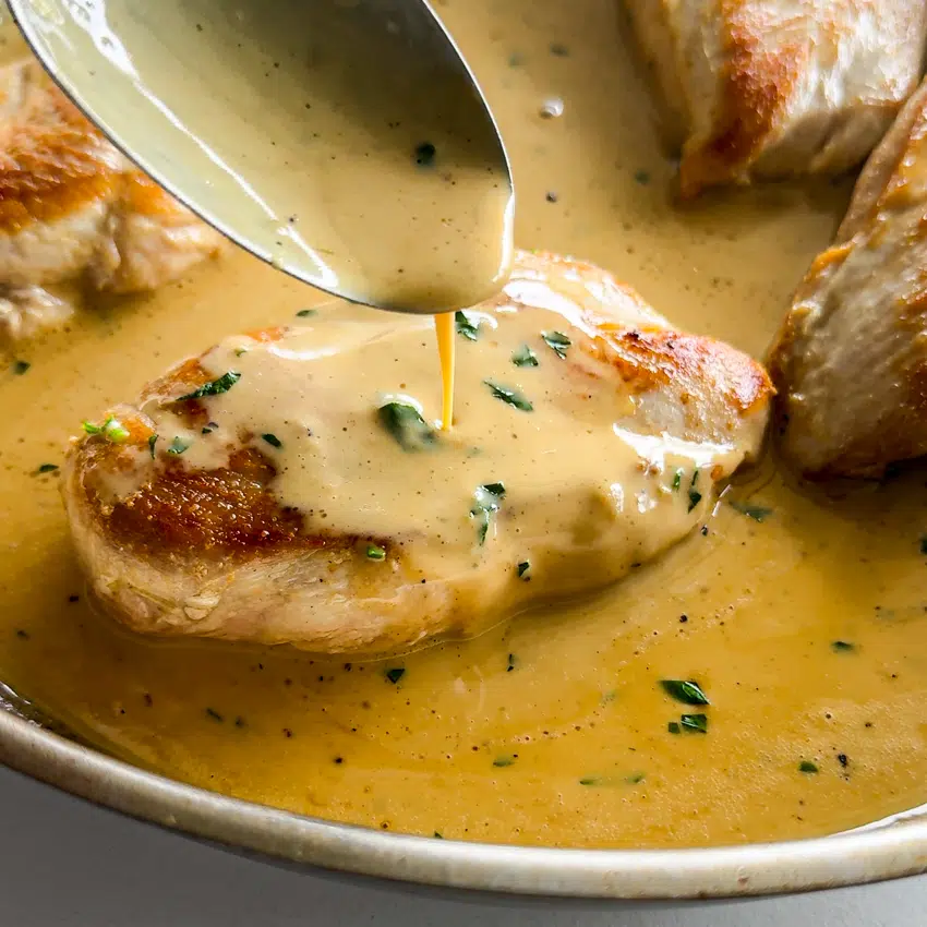 Easy dijon pan sauce spooned over chicken.