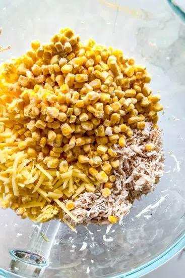 Ingredients for chicken taquitos in a glass bowl.