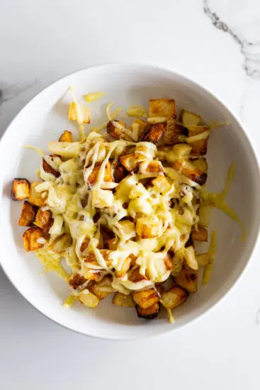 Melted cheese over crispy potatoes.
